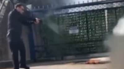 Social media users were shocked to see the man pointing a gun at the dying airman, instead of trying to help him (@Lowkey0nline/X)