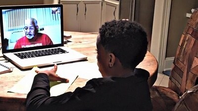 A picture of the grandad tutoring the child on a video call. (X/@gradydoctor) A picture of the grandad tutoring the child on a video call. (X/@gradydoctor)