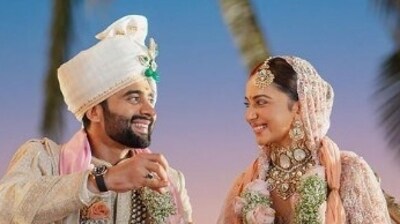 Both opted for designer Tarun Tahiliani's wedding attire on their D-Day.Rakul wore a pink-peach lehenga with enormous diamonds for the wedding. Jackky wore an ivory chikankari sherwani featuring the intricate 'chinar' motif. (Instagram) Both opted for designer Tarun Tahiliani's wedding attire on their D-Day.Rakul wore a pink-peach lehenga with enormous diamonds for the wedding. Jackky wore an ivory chikankari sherwani featuring the intricate 'chinar' motif. (Instagram)