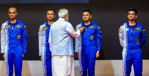Prime Minister Narendra Modi hands-over wings to astronauts-designate Shubanshu Shukla, Prashanth Balakrishnan Nair, Angad Prathap and Ajit Krishnan who have been selected to be the astronauts on India’s first crewed mission to space 'Gaganyaan Mission', at the Vikram Sarabhai Space Centre (VSSC), in Thiruvananthapuram. (PTI) (HT_PRINT) Prime Minister Narendra Modi hands-over wings to astronauts-designate Shubanshu Shukla, Prashanth Balakrishnan Nair, Angad Prathap and Ajit Krishnan who have been selected to be the astronauts on India’s first crewed mission to space 'Gaganyaan Mission', at the Vikram Sarabhai Space Centre (VSSC), in Thiruvananthapuram. (PTI) (HT_PRINT)