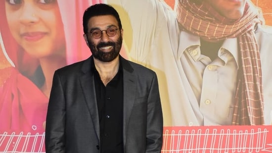 Sunny Deol, for the event, opted for a black shirt under a dark grey jacket and trousers. He also smiled and posed for the paparazzi.