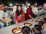 Anant Ambani and his fiancé Radhika Merchant distribute traditional Gujarati food to villagers during 'anna seva'. Anant Ambani and his fiancé Radhika Merchant distribute traditional Gujarati food to villagers during 'anna seva'.