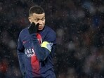 Kylian Mbappe looks on during a match. Kylian Mbappe looks on during a match.