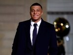 Kylian Mbappe arrives to attend a state dinner organised by French President Emmanuel Macron and his wife Brigitte Macron.