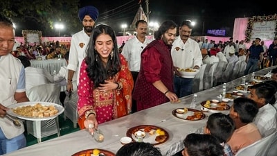 Anant Ambani and his fiancé Radhika Merchant distribute traditional Gujarati food to villagers during 'anna seva'. (ANI) Anant Ambani and his fiancé Radhika Merchant distribute traditional Gujarati food to villagers during 'anna seva'. (ANI)