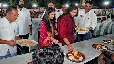 Reliance Industries chairman Mukesh Ambani's youngest son, Anant Ambani, is all set to get married to Radhika Merchant on July 12 in Mumbai. Their pre-wedding festivities commenced on Wednesday with 'anna seva' at Jogwad village near Reliance Township in Jamnagar. (ANI) Reliance Industries chairman Mukesh Ambani's youngest son, Anant Ambani, is all set to get married to Radhika Merchant on July 12 in Mumbai. Their pre-wedding festivities commenced on Wednesday with 'anna seva' at Jogwad village near Reliance Township in Jamnagar. (ANI)