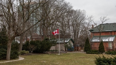 A Canadian flag outside homes in Brampton, Ontario, Canada, on Friday, Jan. 5, 2024. In Canada, a post-Covid explosion in foreign students has resulted in housing shortages and flawed academic programs being taught in strip malls. Photographer: Laura Proctor/Bloomberg (Bloomberg) A Canadian flag outside homes in Brampton, Ontario, Canada, on Friday, Jan. 5, 2024. In Canada, a post-Covid explosion in foreign students has resulted in housing shortages and flawed academic programs being taught in strip malls. Photographer: Laura Proctor/Bloomberg (Bloomberg)