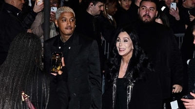 Alexander Edwards and Cher arrive for the presentation of creations by Balmain for the Women Ready-to-wear Fall-Winter 2024/2025 collection as part of the Paris Fashion Week, in Paris on February 28, 2024 (Photo by Miguel MEDINA / AFP) (AFP) Alexander Edwards and Cher arrive for the presentation of creations by Balmain for the Women Ready-to-wear Fall-Winter 2024/2025 collection as part of the Paris Fashion Week, in Paris on February 28, 2024 (Photo by Miguel MEDINA / AFP) (AFP)