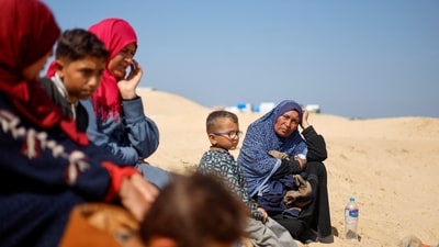 Palestinians gather at Tal Al-Sultan cemetery, amid the ongoing conflict between Israel and Hamas, in Rafah (REUTERS)
