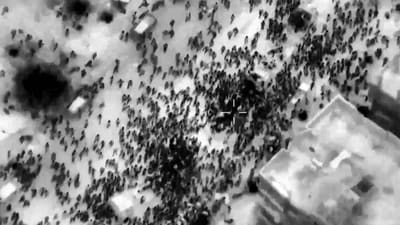 This image grab from a handout video released by the Israeli army on February 29, 2024, shows what the army says are Gazans around aid trucks in Gaza City. Israeli forces shot dead 104 people when a crowd rushed towards aid trucks on February 29, the health ministry in Hamas-run Gaza said. (AFP) This image grab from a handout video released by the Israeli army on February 29, 2024, shows what the army says are Gazans around aid trucks in Gaza City. Israeli forces shot dead 104 people when a crowd rushed towards aid trucks on February 29, the health ministry in Hamas-run Gaza said. (AFP)
