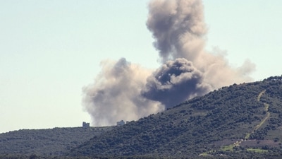 Smoke billows from the site of an Israeli air strike on the outskirts of the southern Lebanese village (AFP) Smoke billows from the site of an Israeli air strike on the outskirts of the southern Lebanese village (AFP)