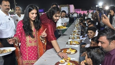 Following the meal, the guests delighted in traditional folk music, with renowned Gujarati singer Kirtidan Gadhvi captivating the audience with his performance. (PTI) Following the meal, the guests delighted in traditional folk music, with renowned Gujarati singer Kirtidan Gadhvi captivating the audience with his performance. (PTI)