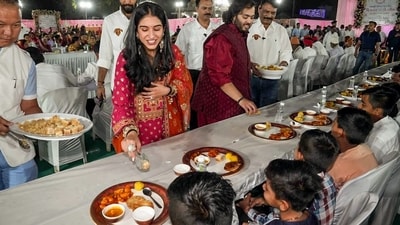 Anant Ambani-Radhika Merchant pre-wedding festivities: Couple serving food to villagers in Jamnagar. (ANI) Anant Ambani-Radhika Merchant pre-wedding festivities: Couple serving food to villagers in Jamnagar. (ANI)