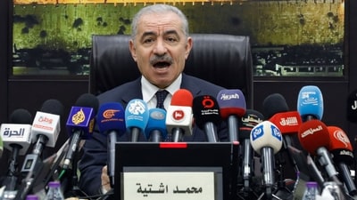 TOPSHOT - Palestinian Prime Minister Mohammad Shtayyeh announces his government's resignation and calls for "new political measures" in Ramallah on February 26, 2024, amid the ongoing war in the Gaza Strip. "The next stage and its challenges require new governmental and political measures that take into account the new reality in the Gaza Strip," he said, as he called for inter-Palestinian consensus and the "extension of the (Palestinian) Authority's rule over the entire land of Palestine". (Photo by Zain JAAFAR / AFP) (AFP)