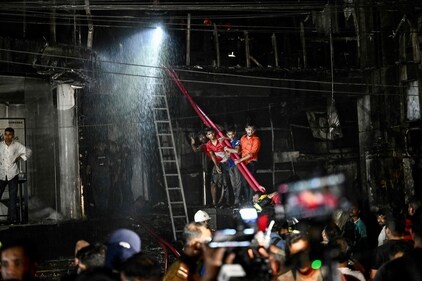 Members of the publichelp as firefighters work to extinguish a fire in a commercial building that killed at least 43 people, in Dhaka, on February 29, 2024. (AFP) Members of the publichelp as firefighters work to extinguish a fire in a commercial building that killed at least 43 people, in Dhaka, on February 29, 2024. (AFP)