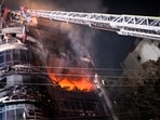 Firefighters used cranes to rescue people from the charred building, said fire officials, who were still working to clear debris and douse any remaining embers.&nbsp;