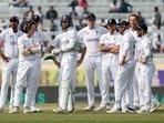 England's Ben Stokes and teammates await for the third umpire decision after taking a DRS review for the possible wicket of India's Yashasvi Jaiswal 