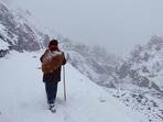 A man walks amid heavy snow at Ropa Valley in Kinnaur district of Himachal on Friday. (HT Photo) A man walks amid heavy snow at Ropa Valley in Kinnaur district of Himachal on Friday. (HT Photo)