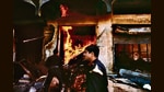 Firemen attempt to stop fires raging in Malad, Mumbai, on January 13, 1993. (Robert Nickelsberg/Getty Images)
