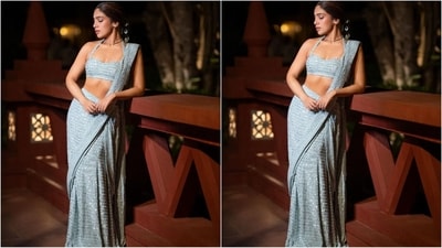 Bhumi's saree is from the shelves of ace fashion designer Arpita Mehta and comes in a stunning ice blue shade. It has shimmering detailing all over which added extra glamour to her look. She paired it with a stylish halter-neck bralette blouse. (Instagram/@bhumipednekar) Bhumi's saree is from the shelves of ace fashion designer Arpita Mehta and comes in a stunning ice blue shade. It has shimmering detailing all over which added extra glamour to her look. She paired it with a stylish halter-neck bralette blouse. (Instagram/@bhumipednekar)