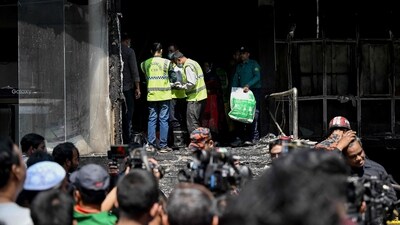 Smoke billowed from the side of the building in video images filmed by a witness on Thursday. (AFP) Smoke billowed from the side of the building in video images filmed by a witness on Thursday. (AFP)