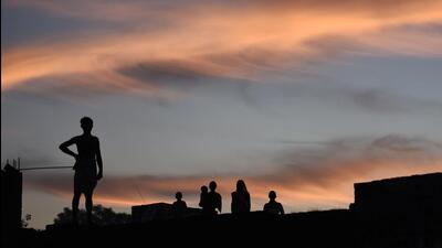For Representation only: Villagers stand on the rooftop of their homes during sunset during wedding celebrations of Sanjay Jatav, in Basai (Burhaan Kinu/HT File PHOTO)