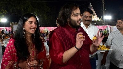 Anant Ambani, son of Mukesh Ambani, Chairman of Reliance Industries, and Radhika Merchant, daughter of industrialist Viren Merchant, serve traditional Gujarati food to villagers ahead of their pre-wedding celebrations on the outskirts of Jamnagar, Gujarat. (REUTERS)