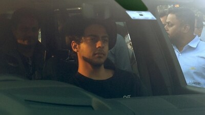 Aryan Khan, son of Shah Rukh Khan, sits in a car after he arrives to attend pre-wedding celebrations of Anant Ambani and Radhika Merchant in Jamnagar. (REUTERS)