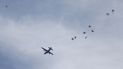 A plane drops aid over Gaza, amid the ongoing conflict between Israel and Hamas, in Gaza City, March 1, 2024. (Reuters)