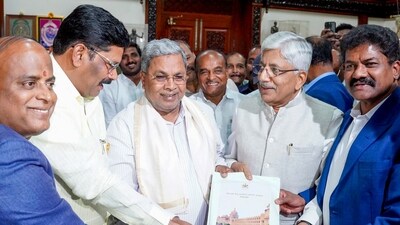 Karnataka State Permanent Backward Classes Commission chairman K Jayaprakash Hegde submitted a voluminous report on the caste survey to CM Siddaramaiah on Thursday. (ANI) Karnataka State Permanent Backward Classes Commission chairman K Jayaprakash Hegde submitted a voluminous report on the caste survey to CM Siddaramaiah on Thursday. (ANI)