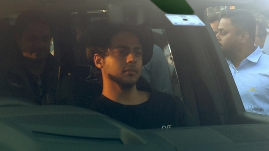 Aryan Khan, son of Shah Rukh Khan, sits in a car after he arrives to attend pre-wedding celebrations of Anant Ambani and Radhika Merchant in Jamnagar.(REUTERS)