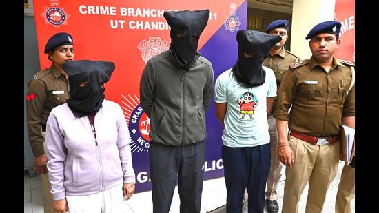 The arrested trio in the custody of Chandigarh Police crime branch. (Keshav Singh/HT)