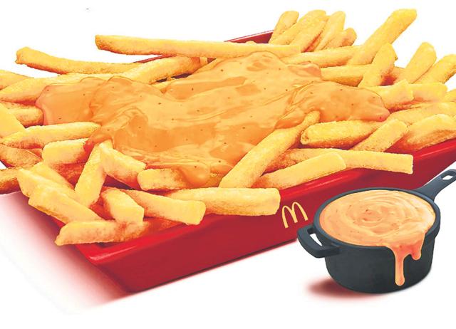 At most fast-food chains, the cheese flavour in fries comes from cheese that’s not 100 per cent dairy. (McDonald’s) At most fast-food chains, the cheese flavour in fries comes from cheese that’s not 100 per cent dairy. (McDonald’s)
