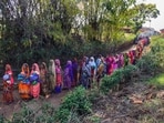 Dindori: Relatives of villagers, who were killed after a pickup vehicle overturned, gather at Amhai Deori village, Shahpura area of Dindori district, Thursday, Feb. 29, 2024. (PTI Photo) (PTI02_29_2024_000251A)