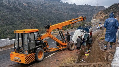 A crane lifts the wrecked remains of a tanker that rammed into a hill in Udhampur on Saturday. (ANI) A crane lifts the wrecked remains of a tanker that rammed into a hill in Udhampur on Saturday. (ANI)