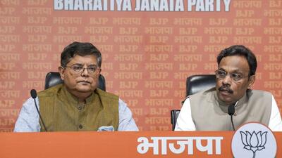 BJP national general Secretary Vinod Tawde (right) announces the party’s first list of candidates for the upcoming Lok Sabha elections at a press conference in New Delhi on Saturday. (PTI) BJP national general Secretary Vinod Tawde (right) announces the party’s first list of candidates for the upcoming Lok Sabha elections at a press conference in New Delhi on Saturday. (PTI)
