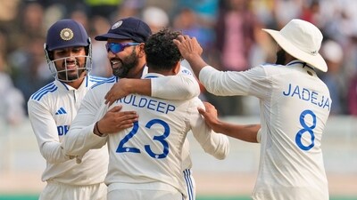 India's Kuldeep Yadav, center, back to the camera, is hugged by captain Rohit Sharma (AP) India's Kuldeep Yadav, center, back to the camera, is hugged by captain Rohit Sharma (AP)