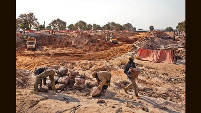 Miners move bags of cobalt at a mining site in Congo. In 2023, this country supplied three-quarters of the world’s cobalt, with children as young as six working in such mines. (Getty Images) Miners move bags of cobalt at a mining site in Congo. In 2023, this country supplied three-quarters of the world’s cobalt, with children as young as six working in such mines. (Getty Images)