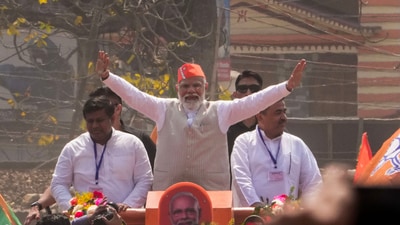 Prime Minister Narendra Modi seen during a road show at Krishnanagar ahead of the public meeting held on Saturday. (PTI) Prime Minister Narendra Modi seen during a road show at Krishnanagar ahead of the public meeting held on Saturday. (PTI)