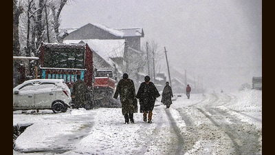 People walk amid fresh snowfall in Shopian on Saturday. (ANI) People walk amid fresh snowfall in Shopian on Saturday. (ANI)