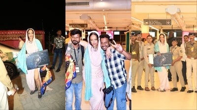 Rihanna poses with paparazzi and cops at Jamnagar airport. Rihanna poses with paparazzi and cops at Jamnagar airport.