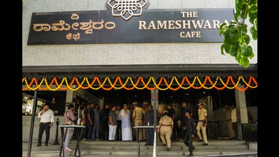 Security personnel stand guard at the Rameshwaram cafe blast site, in Bengaluru. (PTI) Security personnel stand guard at the Rameshwaram cafe blast site, in Bengaluru. (PTI)