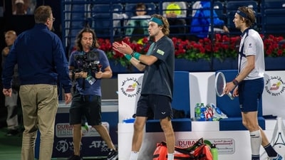 Russia's Andrey Rublev (C) argues with an official after he was defaulted, as Alexander Bublik of Kazakhstan (R) looks on. (AFP) Russia's Andrey Rublev (C) argues with an official after he was defaulted, as Alexander Bublik of Kazakhstan (R) looks on. (AFP)