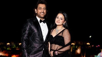 MS Dhoni and his wife Sakshi Dhoni serve couple's fashion goals as they dressed in stunning black ensembles that exuded class and poise. Dhoni looked dashing in a shiny blazer with a lustrous pattern all over. He paired it with a white shirt and a black bow tie. Sakshi rocked a black net saree which she paired with a sweetheart neckline blouse. With a silver statement choker necklace, dewy make-up and open hair, she looked stunning. (Instagram) MS Dhoni and his wife Sakshi Dhoni serve couple's fashion goals as they dressed in stunning black ensembles that exuded class and poise. Dhoni looked dashing in a shiny blazer with a lustrous pattern all over. He paired it with a white shirt and a black bow tie. Sakshi rocked a black net saree which she paired with a sweetheart neckline blouse. With a silver statement choker necklace, dewy make-up and open hair, she looked stunning. (Instagram)