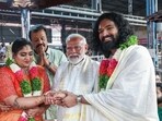 Prime Minister Narendra Modi blesses the newly-wedded daughter and son-in-law of actor-politician Suresh Gopi (centre) while visiting Guruvayur Temple in Thrissur district