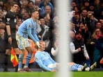 Manchester City's Erling Braut Haaland celebrates scoring their third goal with Phil Foden 