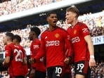 Manchester United's Marcus Rashford celebrates scoring their first goal with Scott McTominay 