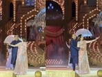 Mukesh Ambani and Nita Ambani dancing on stage to a Bollywood song during Anant Ambani and Radhika Merchant's pre-wedding festivities in Jamnagar, Gujarat. Mukesh Ambani and Nita Ambani dancing on stage to a Bollywood song during Anant Ambani and Radhika Merchant's pre-wedding festivities in Jamnagar, Gujarat.