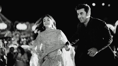 Alia Bhatt wore a golden lehenga and V-neck choli. She accessorised with maang tika and earrings. Ranbir Kapoor was seen in a navy blue and silver sherwani. Alia posted their photos from the event on Instagram. In a black-and-white picture, the duo was seen running. Alia Bhatt wore a golden lehenga and V-neck choli. She accessorised with maang tika and earrings. Ranbir Kapoor was seen in a navy blue and silver sherwani. Alia posted their photos from the event on Instagram. In a black-and-white picture, the duo was seen running.