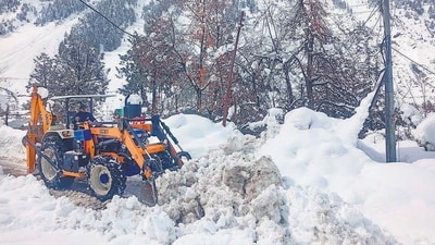 A snow clearing machine being used to remove snow from a road at Sissu, in Lahaul and Spiti district, Sunday. (PTI) A snow clearing machine being used to remove snow from a road at Sissu, in Lahaul and Spiti district, Sunday. (PTI)